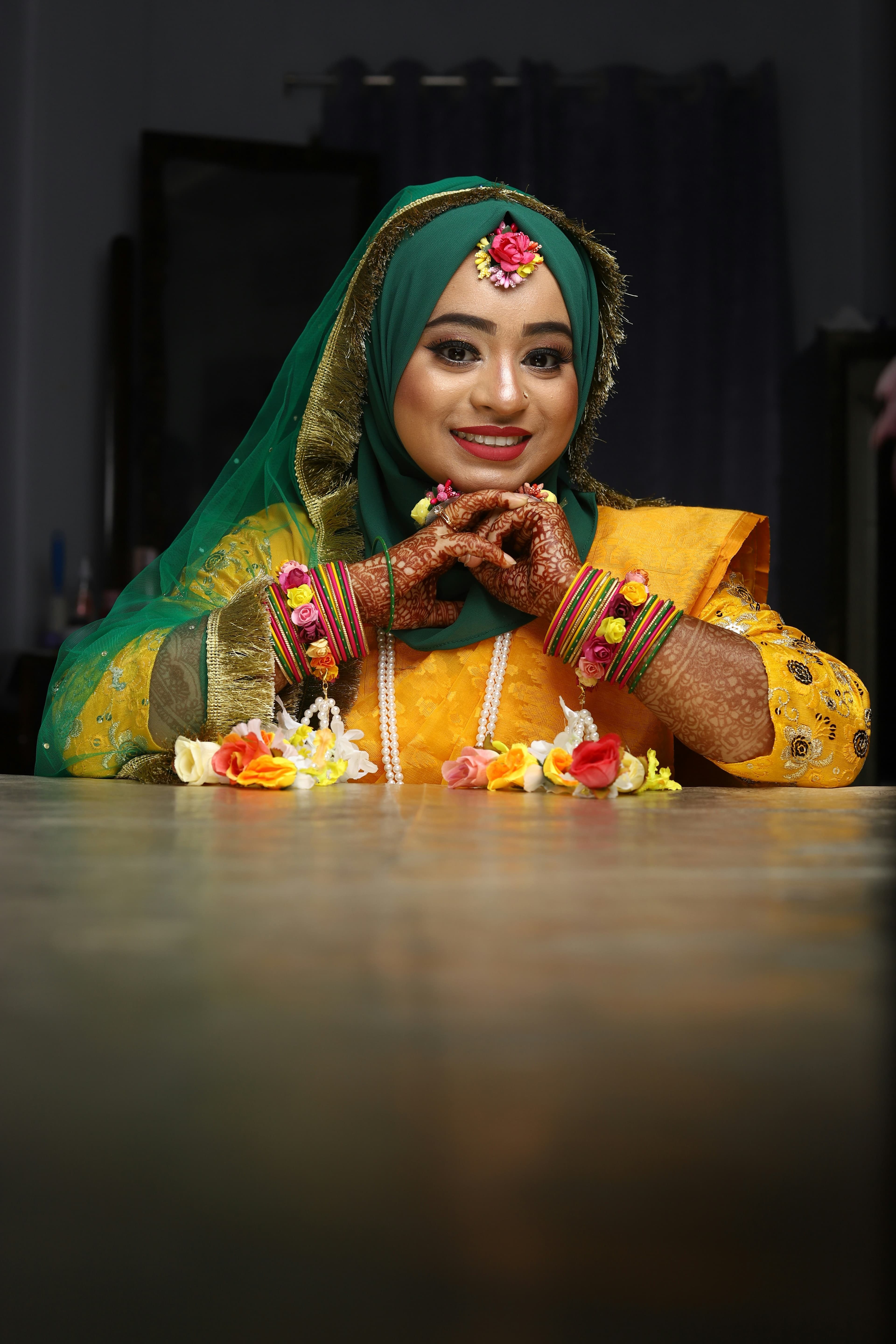 A bride looking stunning in her vibrant wedding outfit.